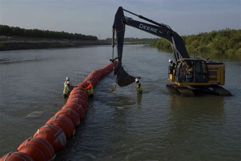 Biden administration, Texas duel in US appeals court over floating .